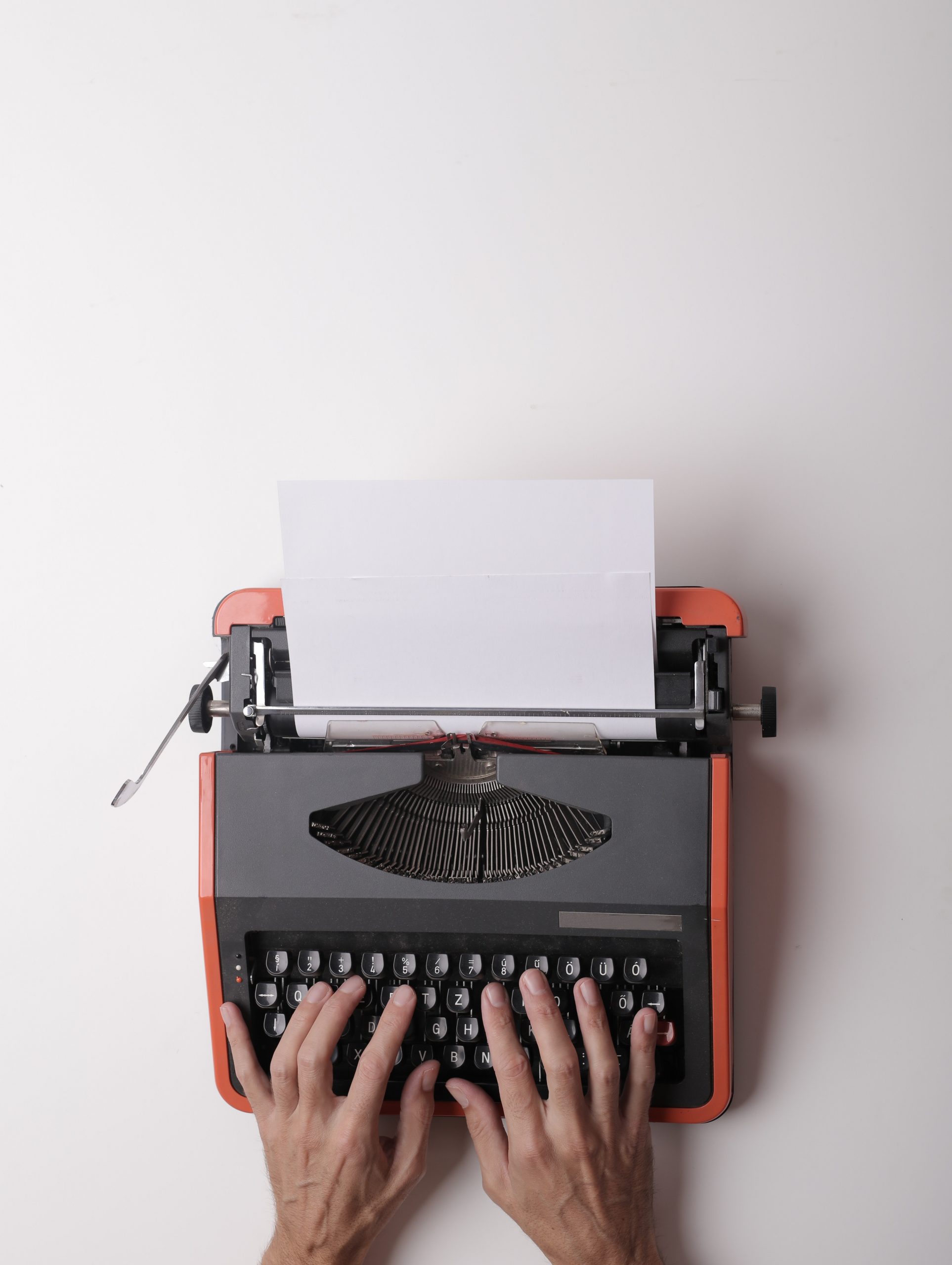 writer-working-on-typewriter-in-office-3808904