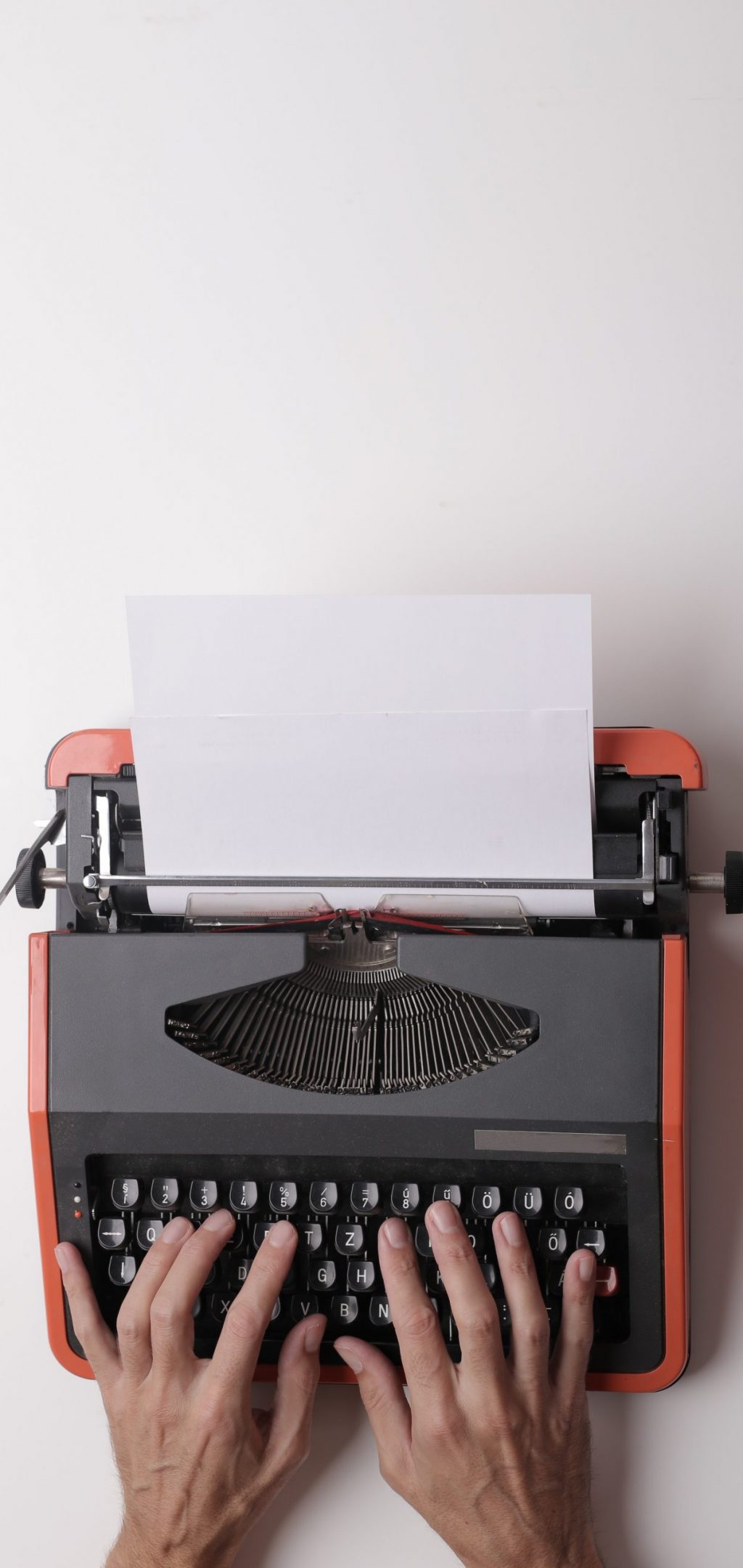 writer-working-on-typewriter-in-office-3808904